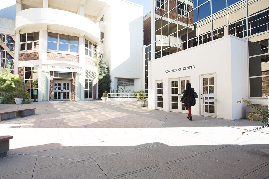 person walking to main entrance