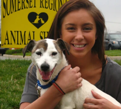 rvcc service learning program participant holding a dog