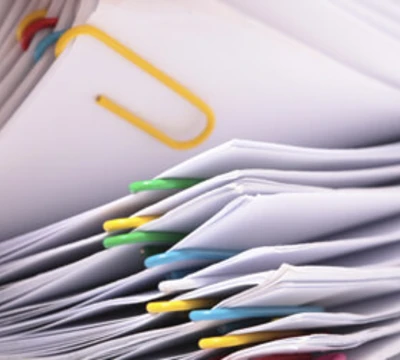 stack of paper clipped files