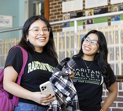 two students with big smiles