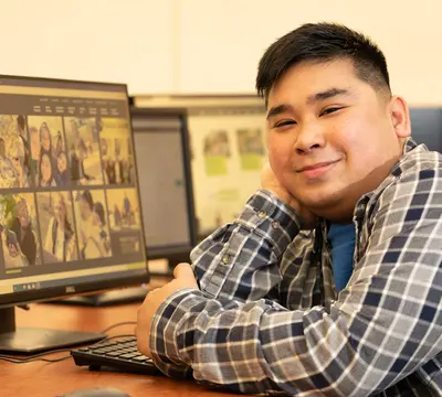 smiling male student in library