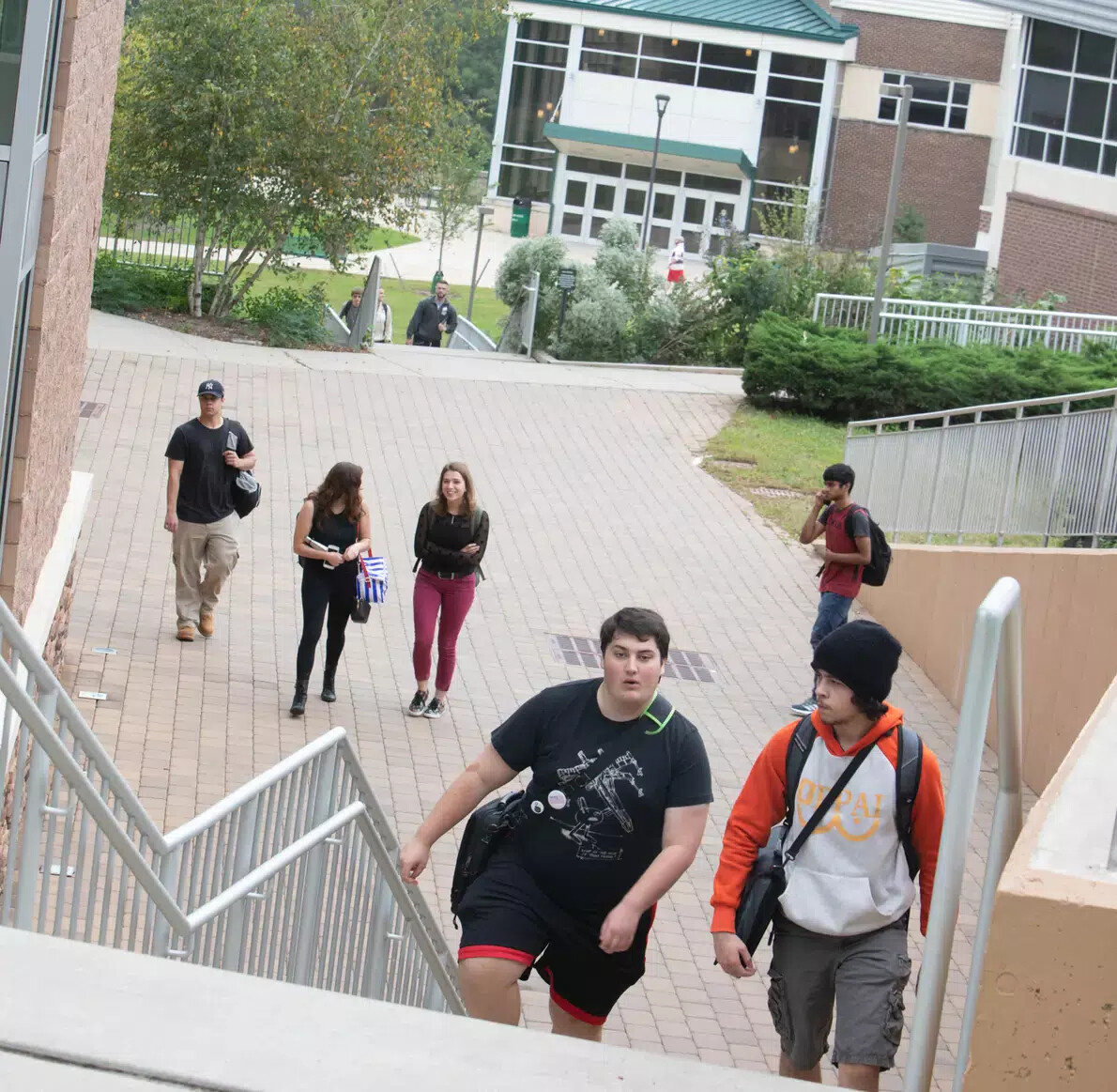 student walking up steps near bateman center