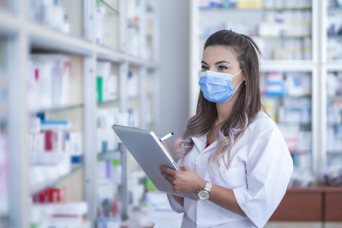 female pharmacist wearing face mask