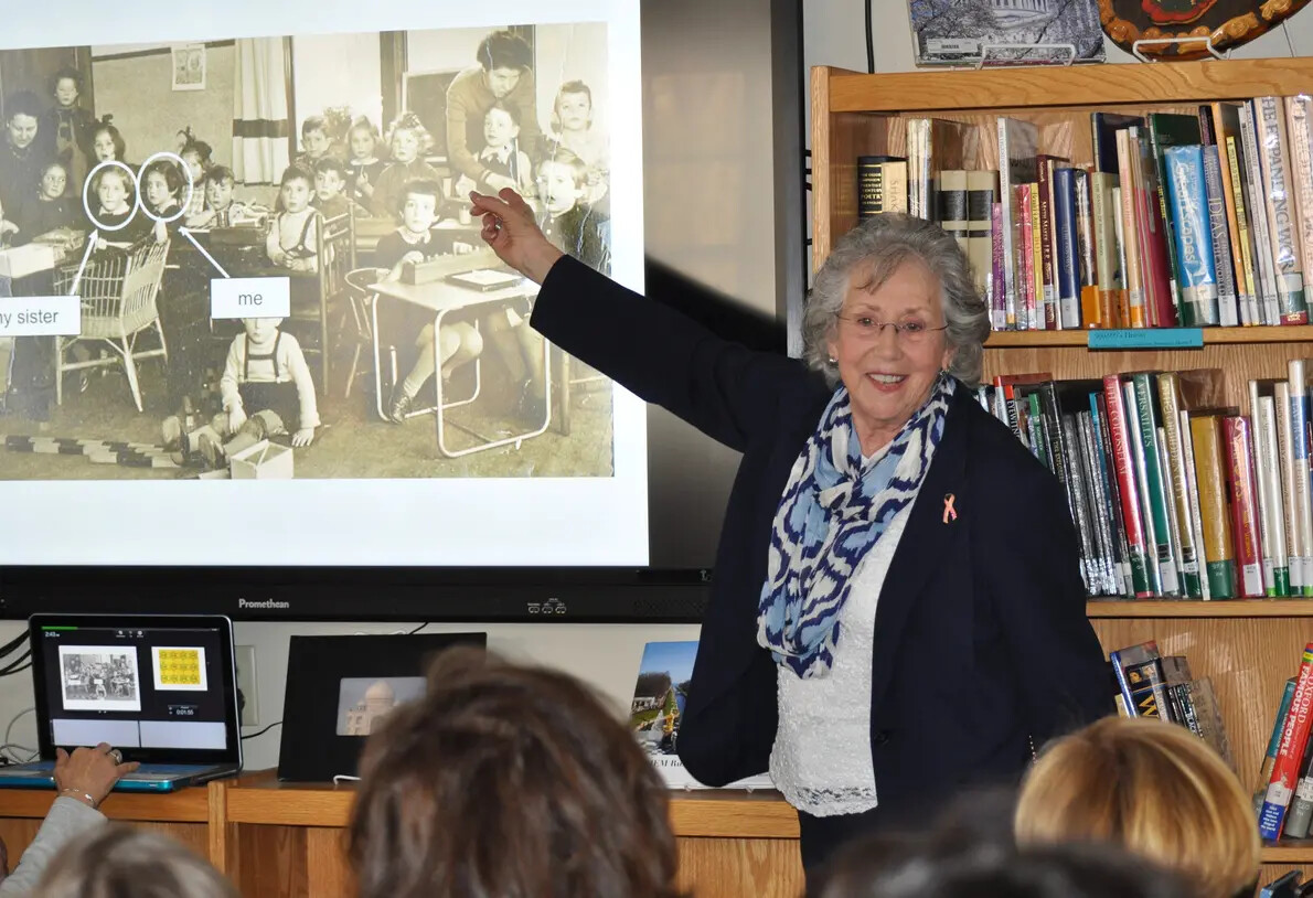 Holocaust survivor maud dahme pointing at screen