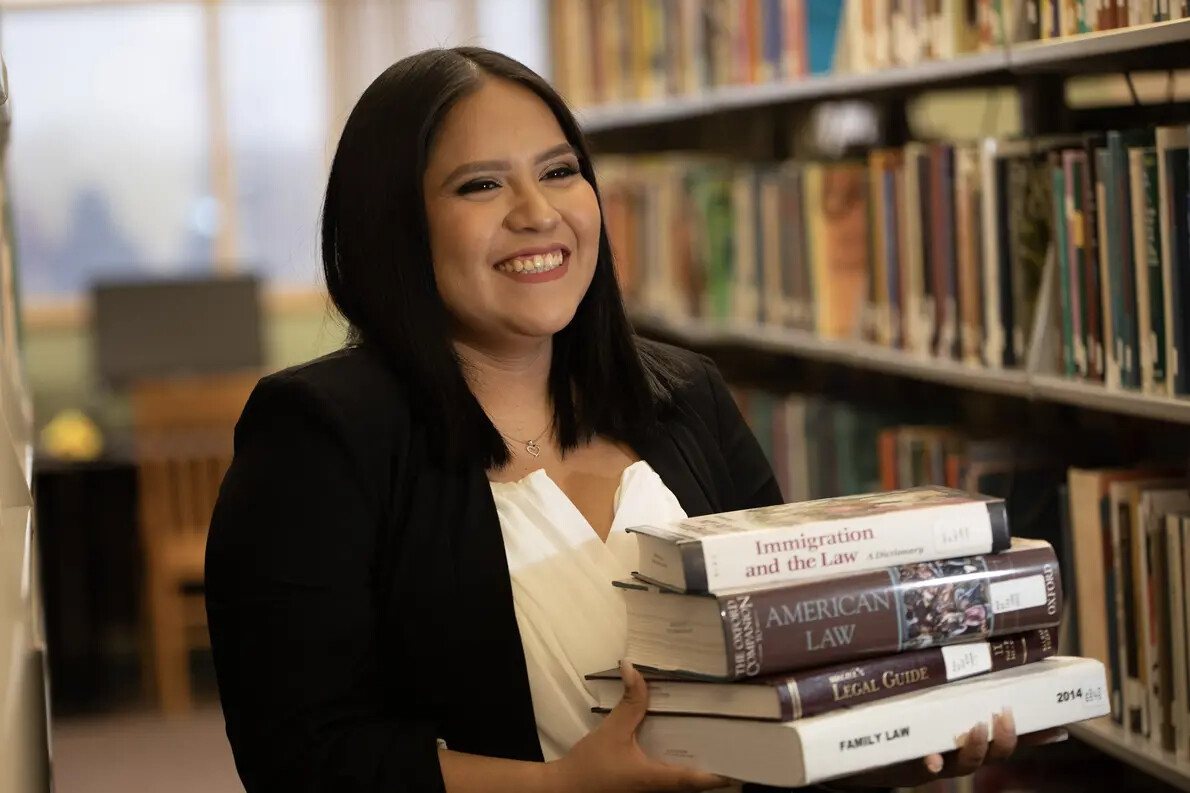 yanely with law books in library