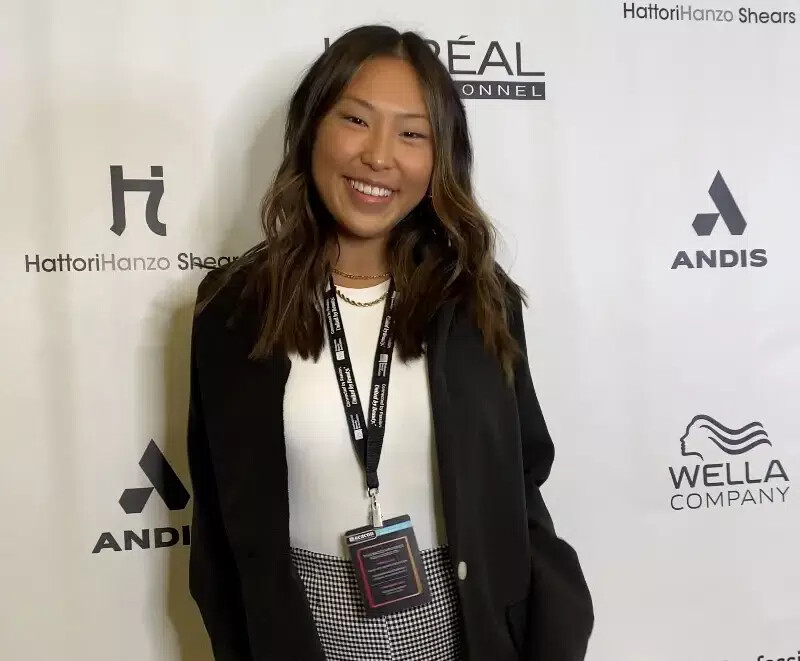 emma mcjury wearing white top and name tag