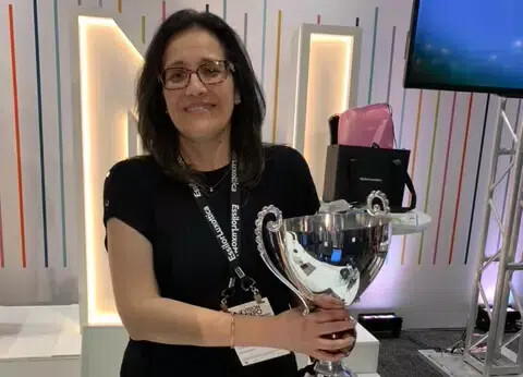 woman in black shirt with trophy