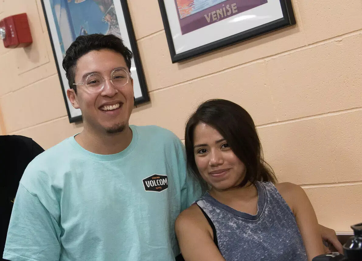 male student with glasses and brown-haired female student