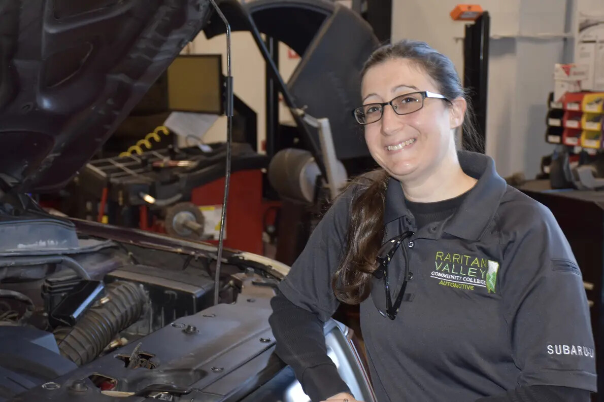 sara heller leaning on car