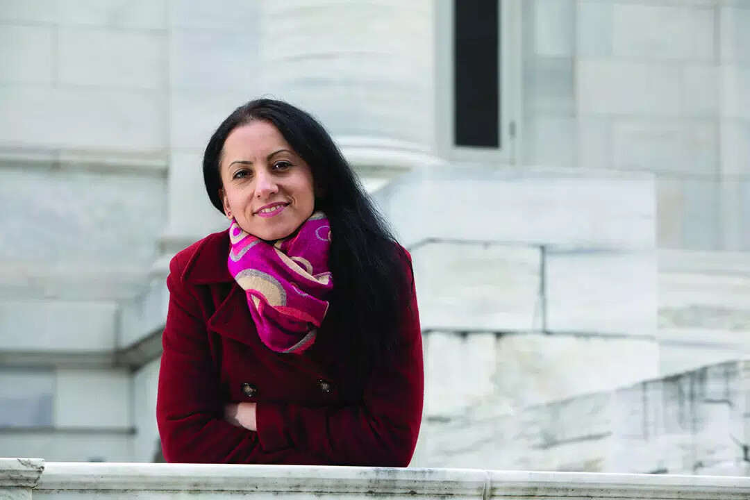 faranak outside in red coat and scarf