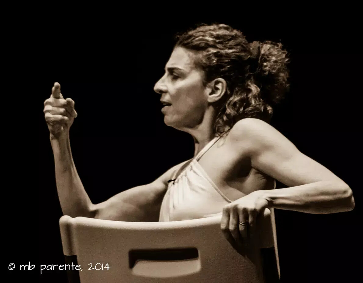 black and white photo of loretta fois sitting on chair