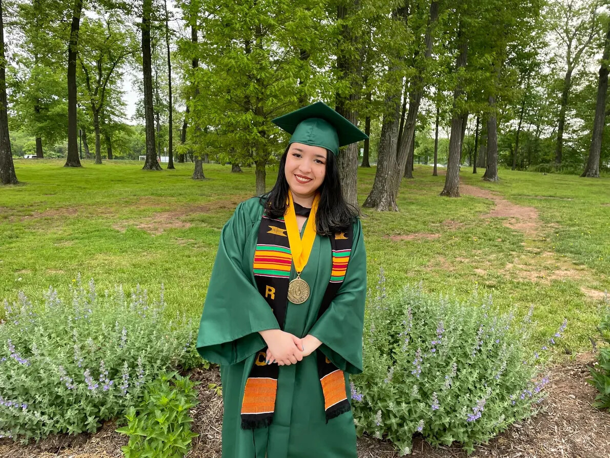 Sarah Lopez graduate outside