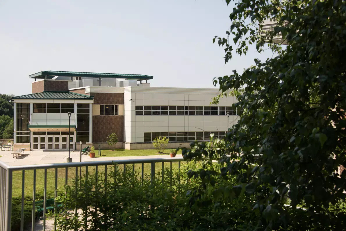 west building with trees on right side