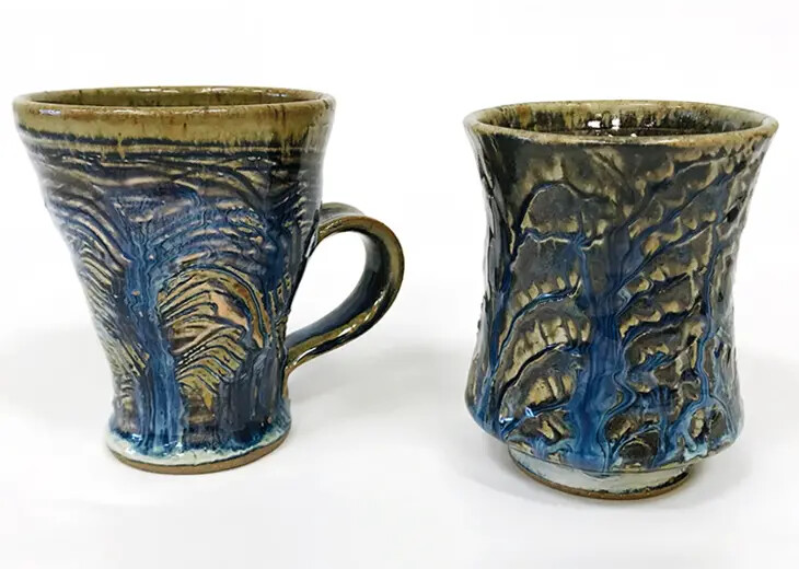 2 colorful ceramic mugs