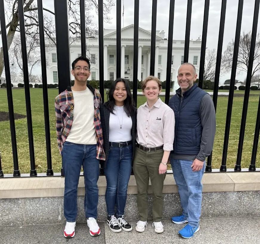 greg with 3 honors college students