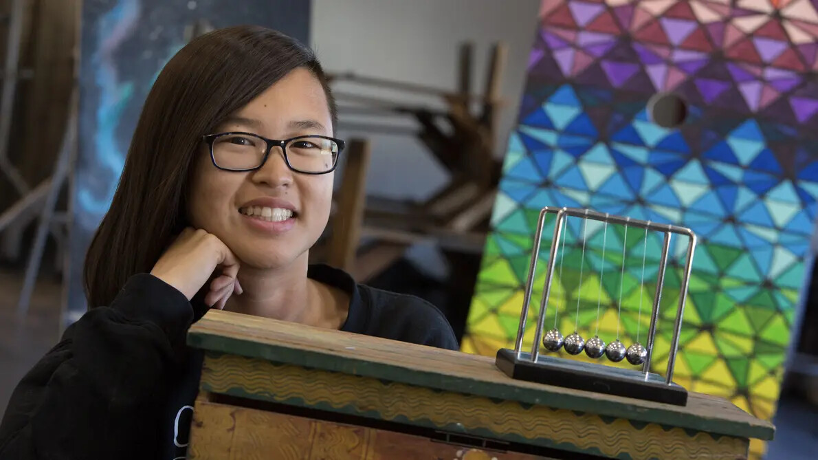 girl with glasses and metal balls on strings