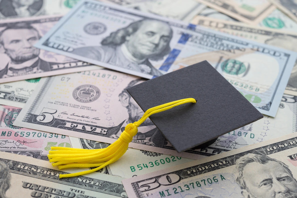 graduation cap and money