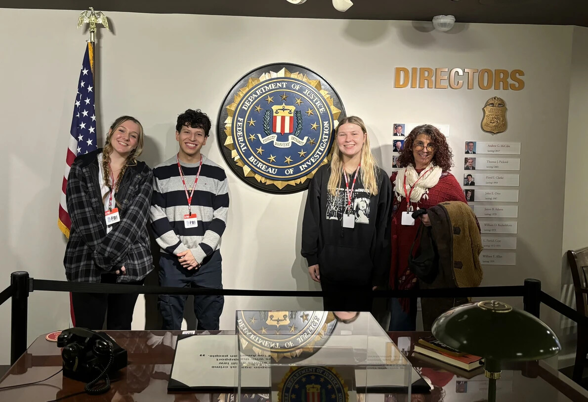 honors college students with loretta in presidential display area