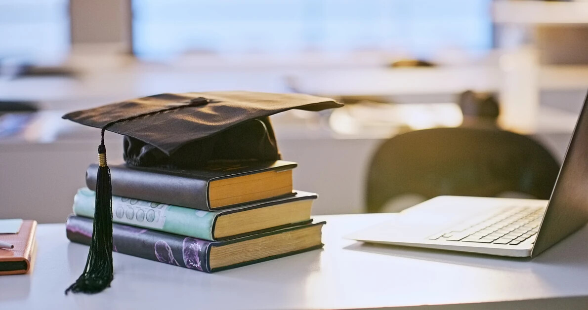 books, cap, tassel, laptop