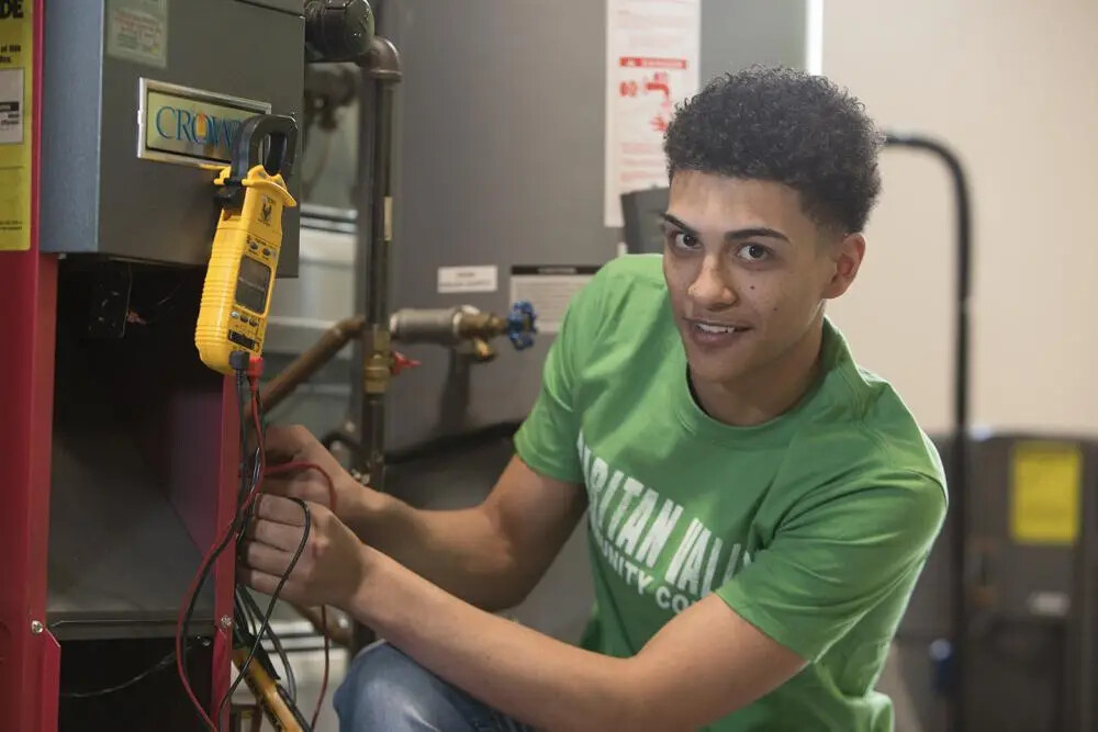 wf male student in green rvcc shirt