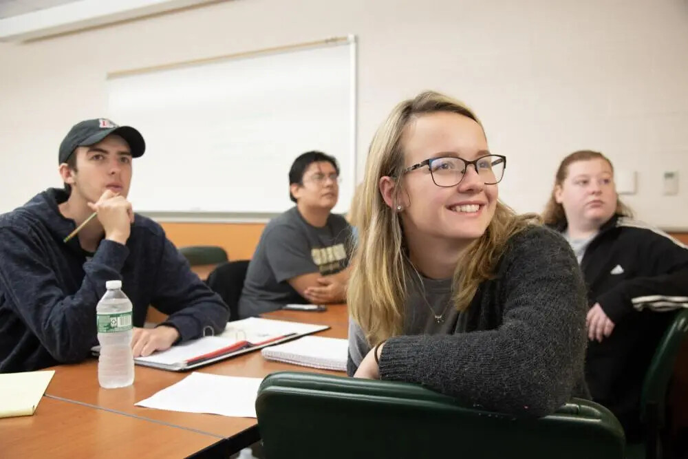 four students in classroom