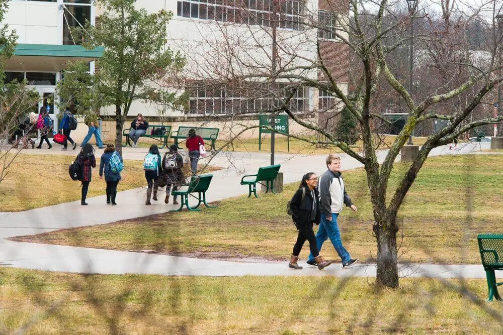 walking outside near west building