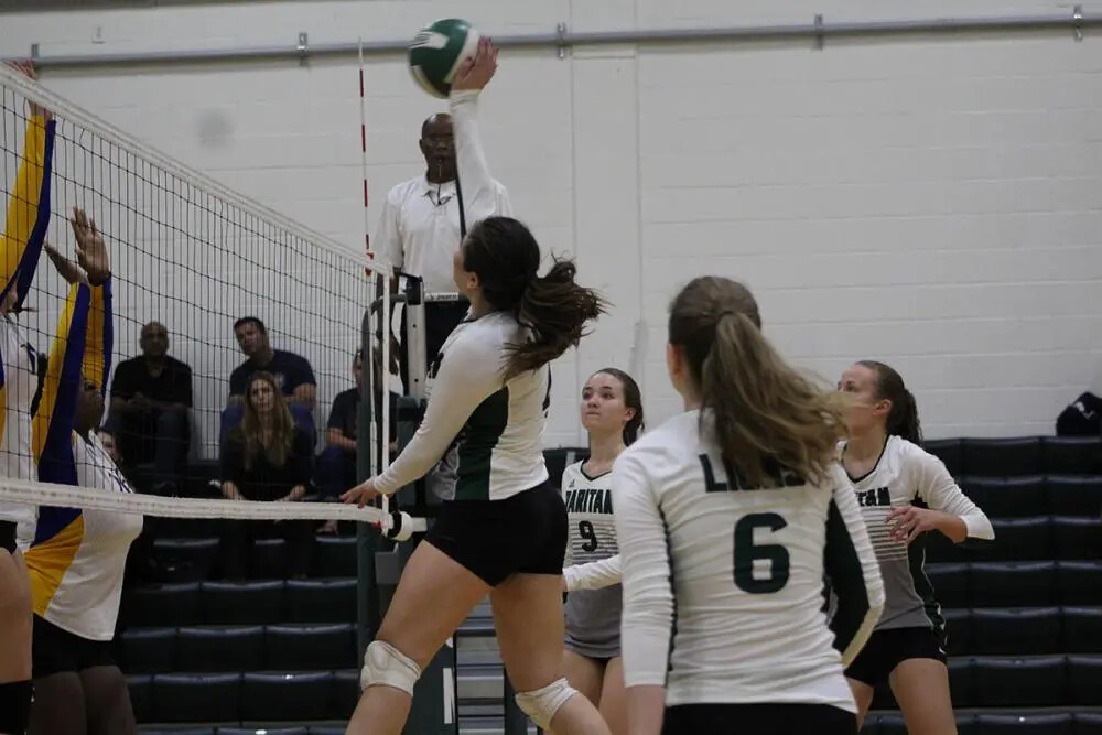 women's volleyball jumping in air