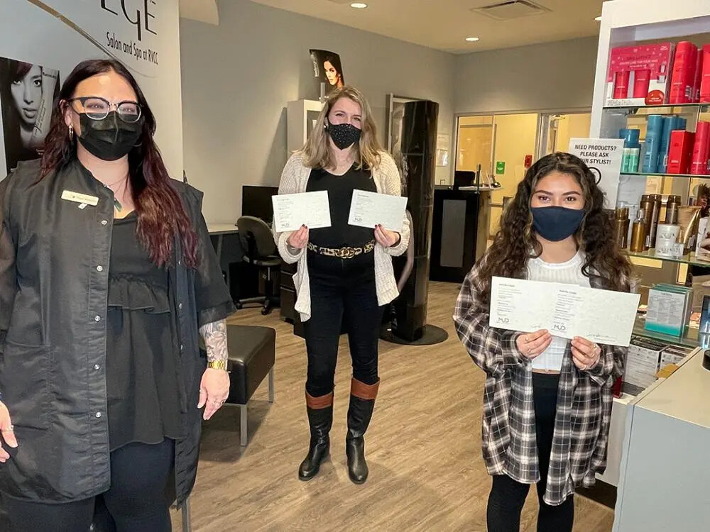 instructor and 2 MUD students holding certificates