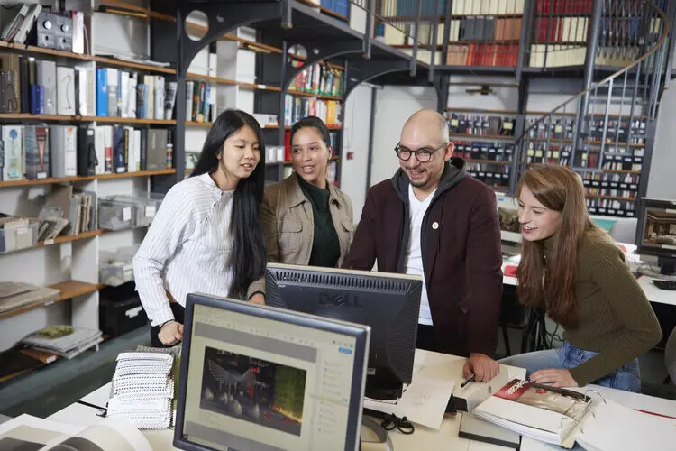 male teacher with interior design students