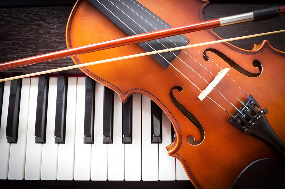 violin on a piano