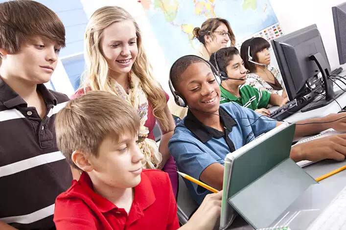 young teens in computer lab