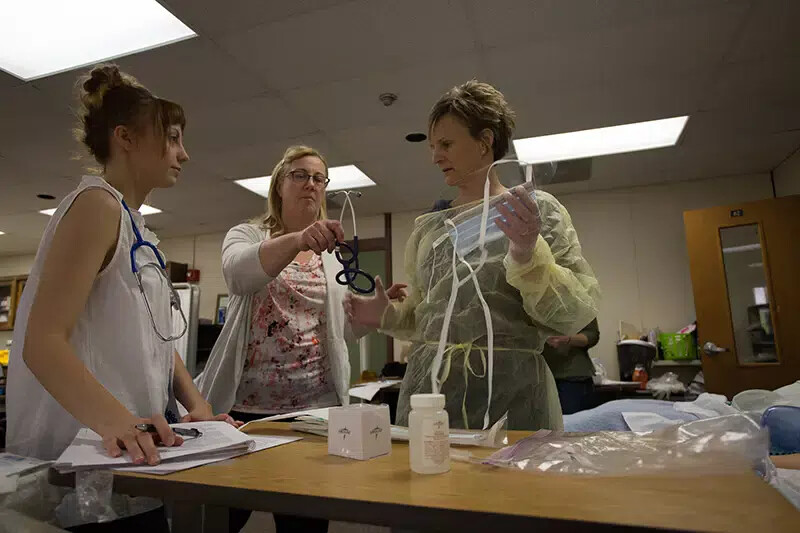 nursing students with faculty member