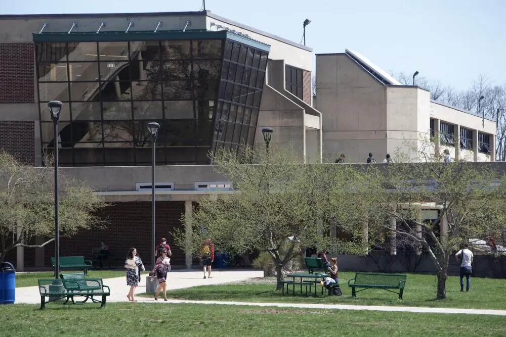 campus photo outside with faculty, staff and students