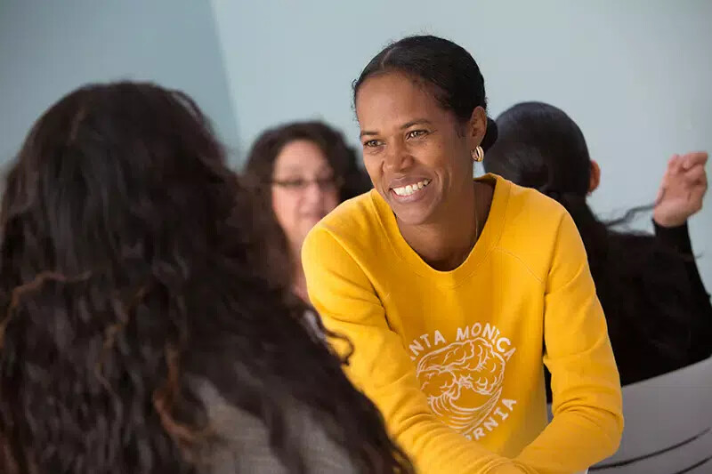 older student in yellow top