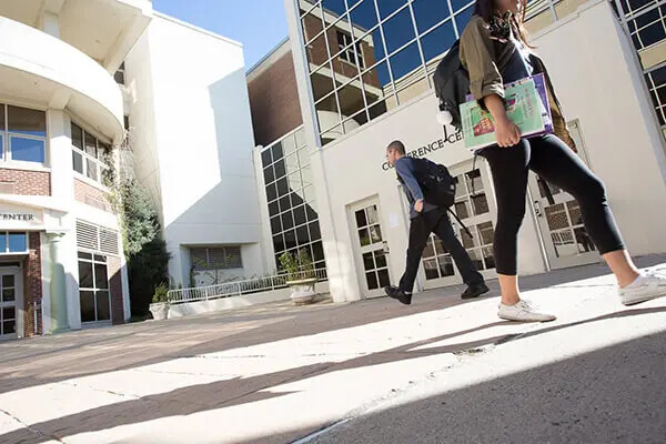 looking up at students walking in front entrance