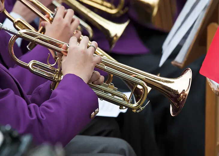 row of trumpet players