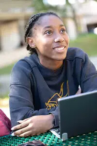 rvcc student at table with laptop