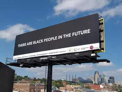 black background billboard with white letters