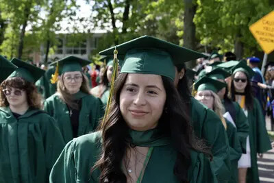 close up on grad in walking line
