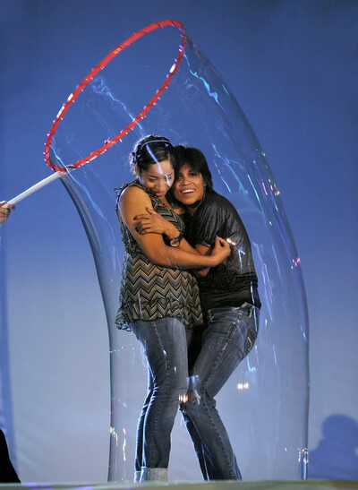 two people in giant bubble