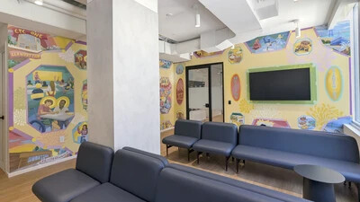 murals on walls with couches