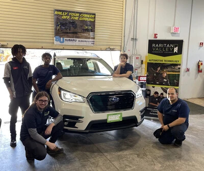 automotive students with white car