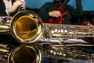 saxophones on mirrored table