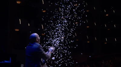 confetti coming out of machine in magic show