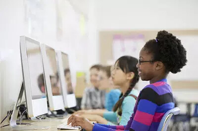 row of kids at computers