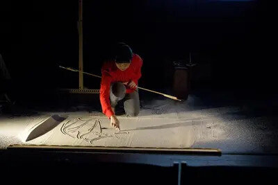 Bend artist working with sand
