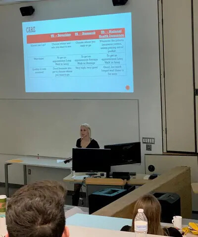 blonde haired student speaking to group