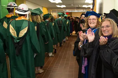 faculty clapping grads
