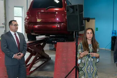 Gary Hazard and Elizabeth Coccia in auto tech shop